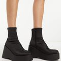 ALDO Silo black satin wedge ankle boot retailer catalog reference. Actual pre-owned size 11 pair shown in the second photo.