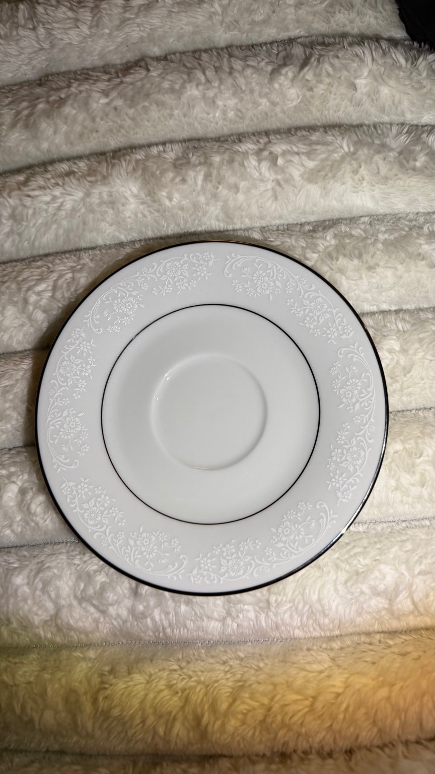 Noritake Tahoe 2585 saucer with white floral scrollwork and metallic trim