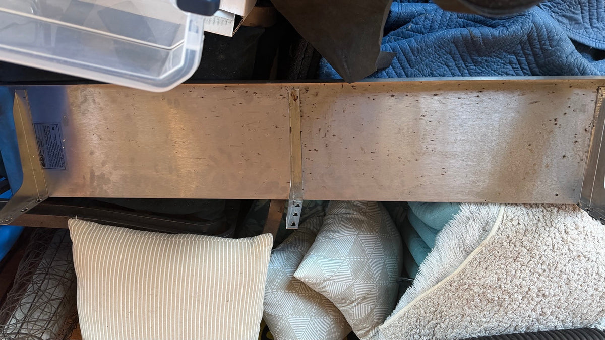 Actual underside of Eagle SWS1260-16/4 shelf showing three support components, including distinct center bracket; configuration unverified